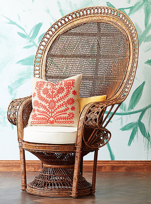 This wicker peacock chair is made of woven rattan in a natural honey hue that projects tropical warmth.

