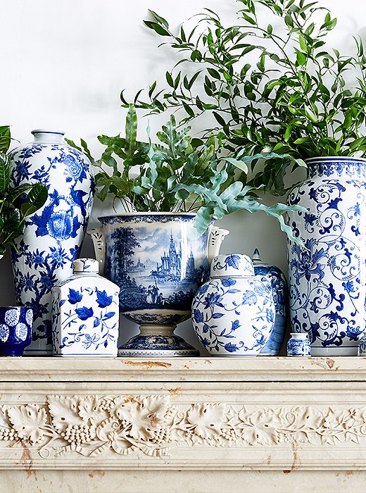 A collection of chinoiserie ceramics in every shape and size turns the fireplace into a striking focal point.
