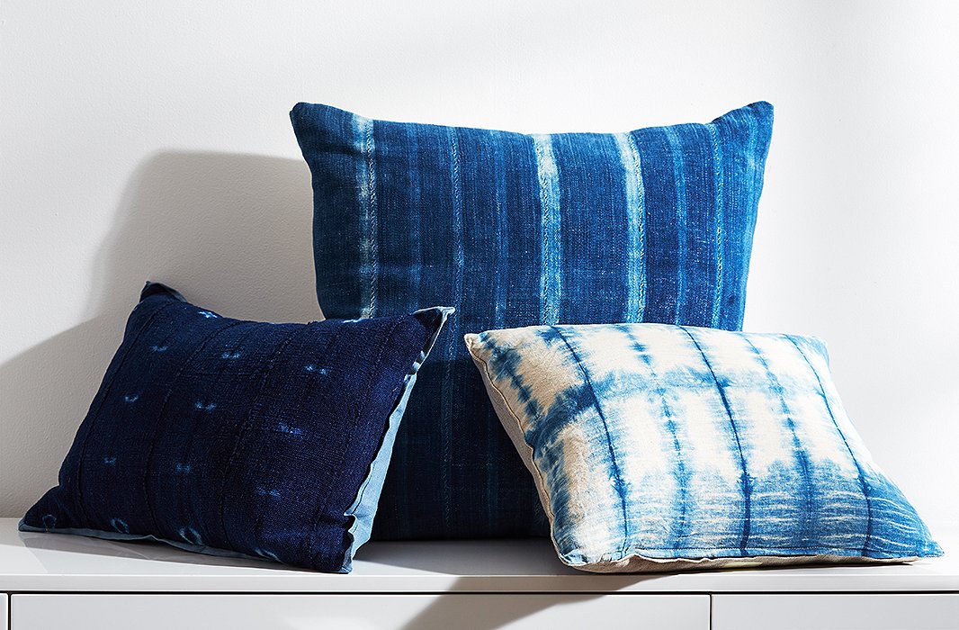 The use of indigo dye in textiles transcends cultures, appearing on African mud cloth (left and center) and shibori from Japan (right).
