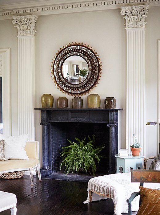 A feathery fern brings fresh life to a dark fireplace—and a jolt of color to an otherwise-neutral room. Photo by Manuel Rodriguez
