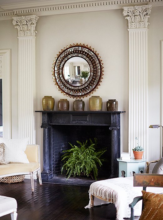 A feathery fern, real or faux, brings fresh life to a dark fireplace—and a jolt of color to an otherwise-neutral room. Photo by Manuel Rodriguez
