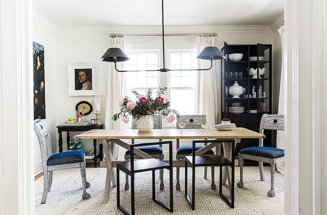 Mismatched chairs take center stage in the dining room of Michelle Adams’s Michigan home. Photo by Lesley Unruh
