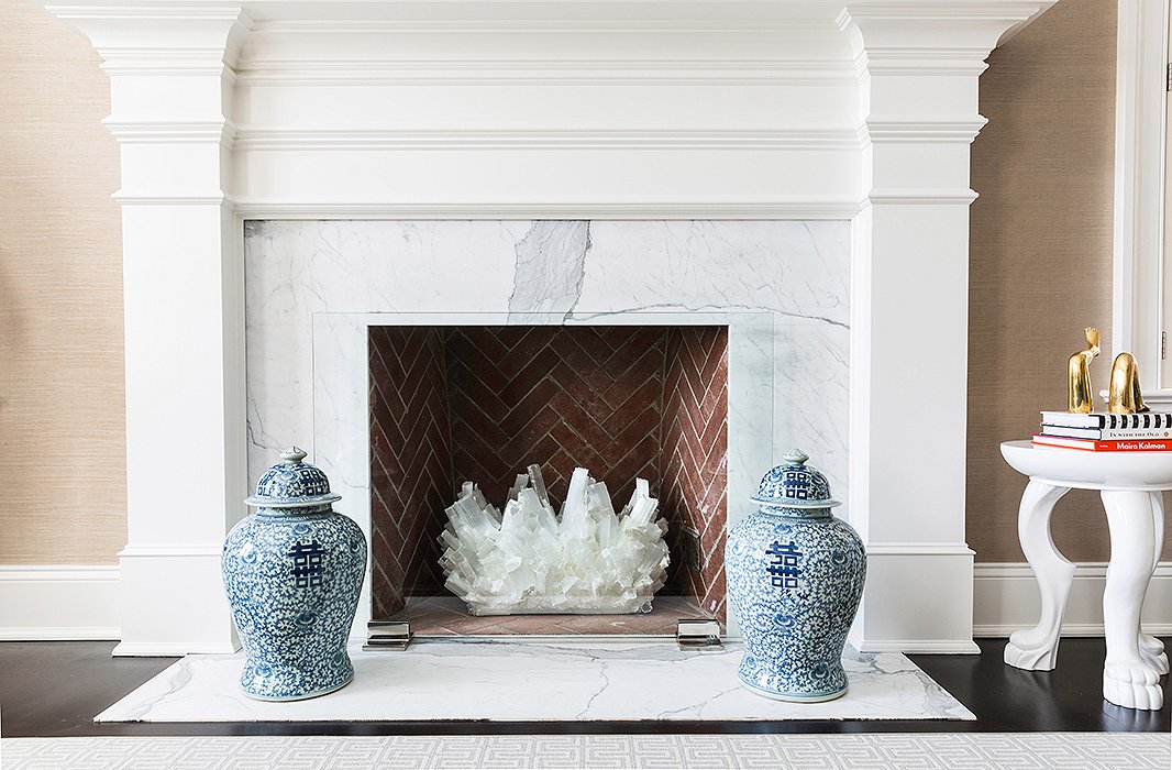 Flanked by a set of blue-and-white ginger jars, a large crystal takes the place of a roaring fire—and gives off nearly the same amount of sparkle. Photo by Lesley Unruh
