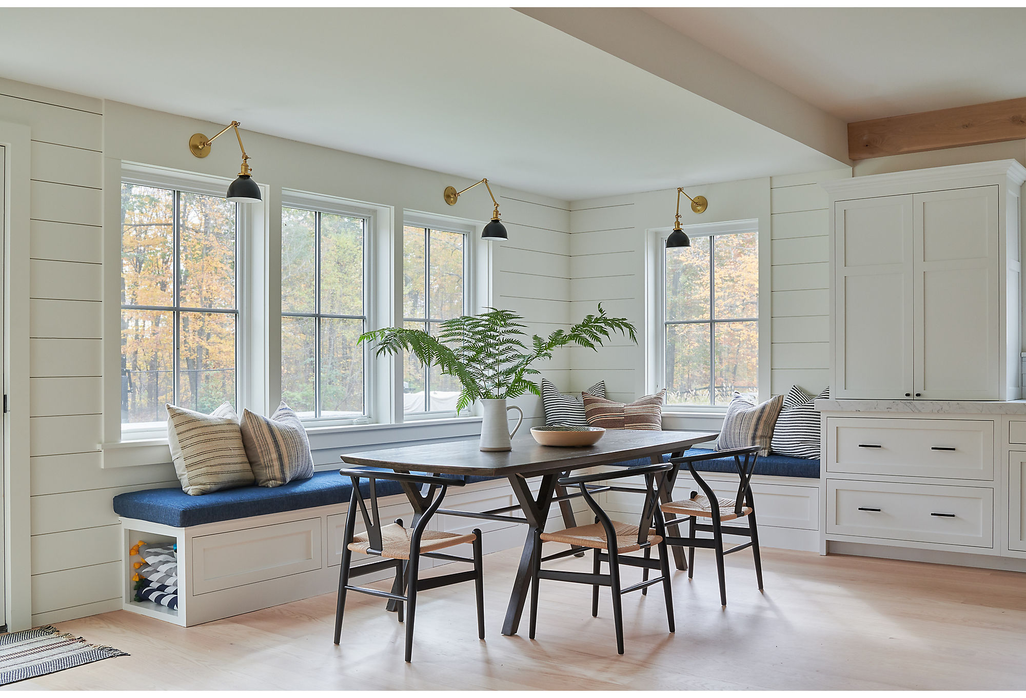 Even though the home included popular nods to modern farmhouse, like the shiplap paneling in the dining area, Kelly kept things fresh by pairing them with unexpected elements such as vintage textiles. Find similar chairs here.
