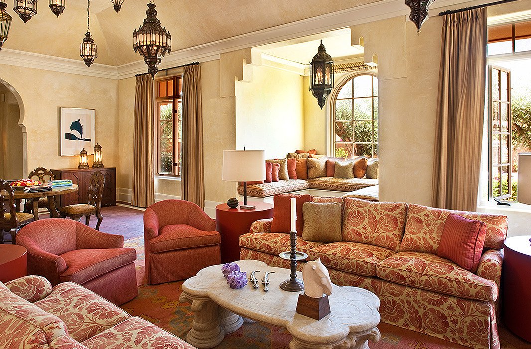 Custom sofas and chairs complement the hues found in the living room’s Oushak rug, which informed the color palette used throughout the house. 
