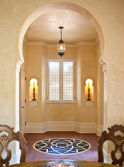 Wooden shutters and brick floors help keep the interior cool. 
