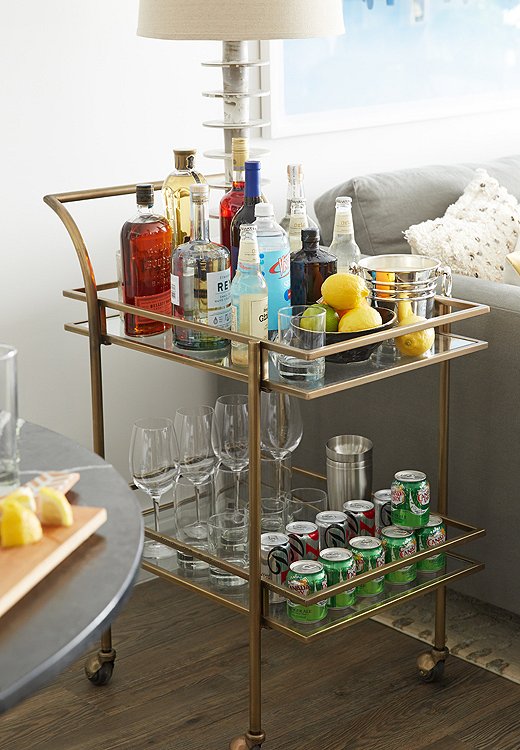 As an alternative to a side table, Andrew placed a lamp on a bar cart so that it can be used as a side table and to hold beverages.
