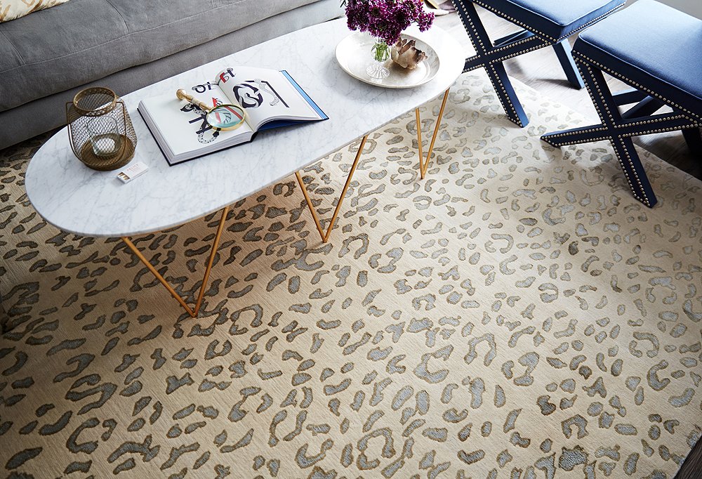 A leopard rug in a soft palette defines the open seating area and makes it feel like a true living space of its own.
