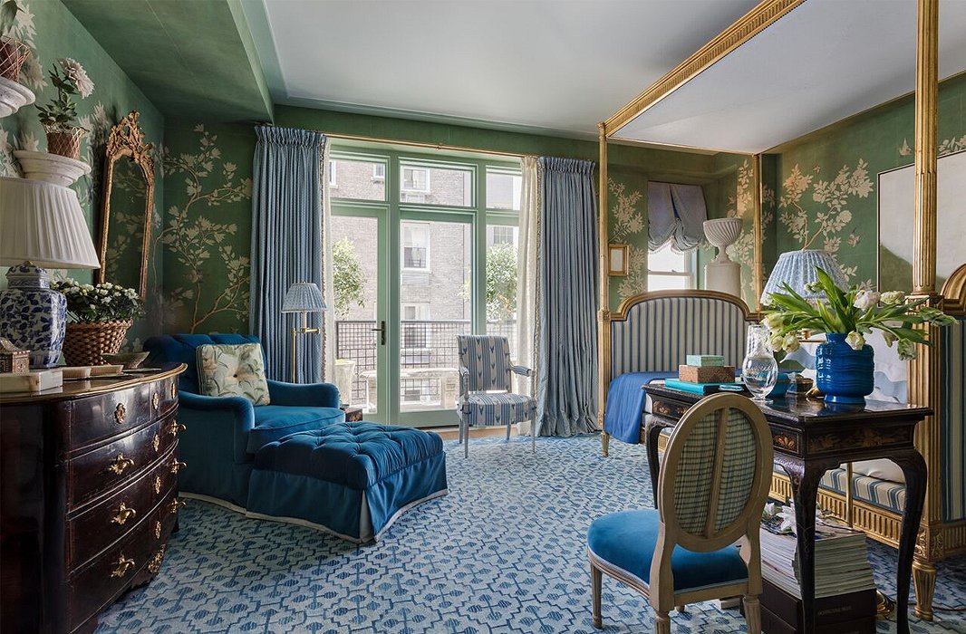 Blue is a component of green, so you can feel safe pairing the two hues. Here the green background of the walls provides chic support to the palette of blues. Photo by Nickolas Sargent.
