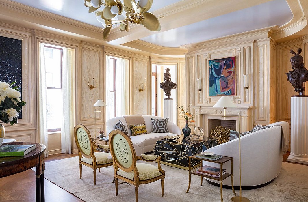 Parisian romance meets New York sophistication in this living room by show-house chair Bunny Williams. Oak paneling flecked with gold picks up on the shimmer of a silk rug and Louis XV chairs dressed in Fortuny. As to inspiration, it wasn’t a pied-à-terre or a Park Avenue penthouse that came to Bunny’s mind, but a treehouse—“one where you can look at the sky through gilded leaves and watch a spider make a giant cobweb,” she says.
