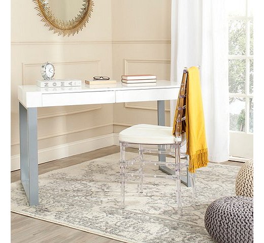With its modern lines, silvery legs, and smooth white top, the two-drawer Kenneth Desk fits effortlessly into a Curator’s bedroom, library, or den.
