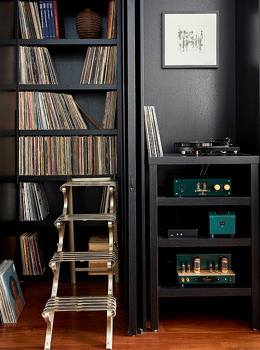 A sculpture bought at auction was intended to be used as a stepladder but turned out to be too heavy to move. The collection of records, many picked up along the couple’s travels, is something of a prized possession. “My husband and I are both music-lovers,” says Kim. “I grew up in a house with R&B, disco, jazz, and funk, and he grew up in a house where they were only allowed to listen to classical music. I’ve definitely introduced him to a few new things.” 
