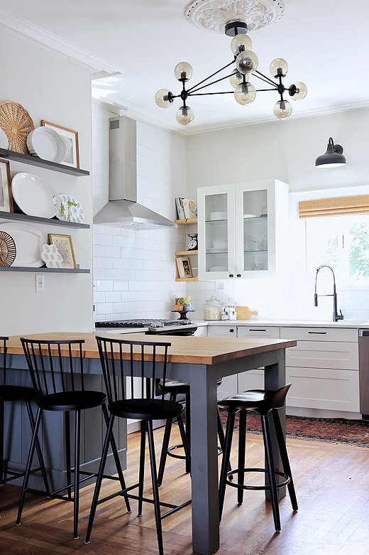 Ceiling medallions were a popular feature throughout the latter half of the 19th century. All the medallions seen in Carli’s home are original to the house.Find similar low-back stool here.
