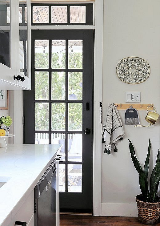 One of Carli’s favorite parts of the renovation was saving this transom window. Previous owners had boarded it up, and she restored it by hand.
