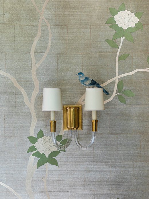 “We wanted to do a traditional chinoiserie wallcovering from Gracie Studio but in a fresh, impressionist way,” says Marie. The Gracie team brought her vision to life by minimizing the blooms and leaves on the tree. The effect was the dramatic and well-known look of Gracie designs in a more sculptural manner.
