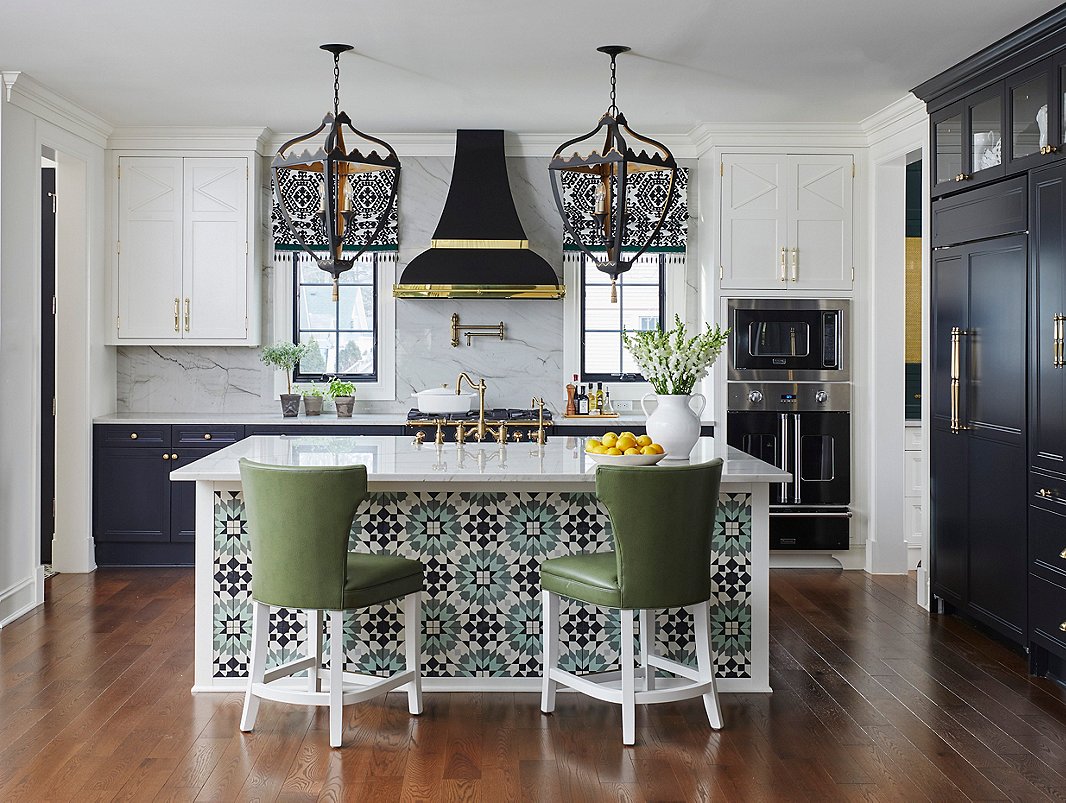 The custom tile on the island, the striking pendants, and the patterned window shades referenced the client’s love of all things Moroccan and French.
