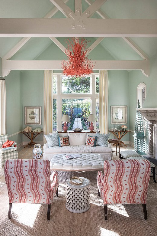 The flow of color throughout the living room makes it feel grounded, less grand. “The chandelier brings in the color palette we had going on below,” says Melissa. “There’s a formality to the space and we wanted to throw that off.”
