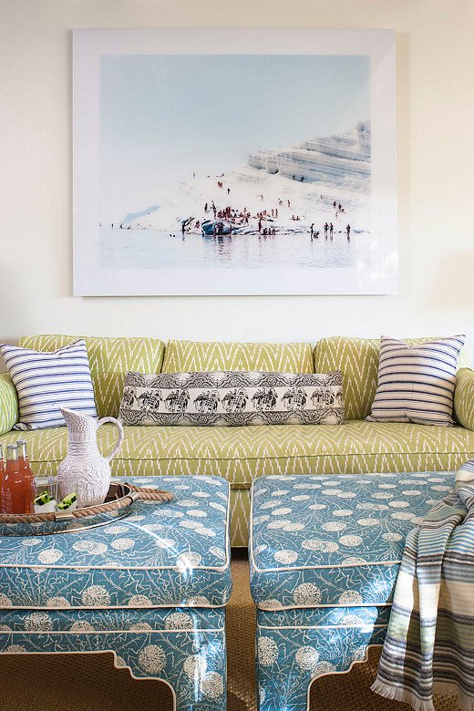 The pattern-filled family room needed a dash of something classic to pull it together. This beach scene from famed Italian photographer Massimo Vitali did just that. “We always make sure there is something clean that relaxes your eye in a room,” says Melissa. 
