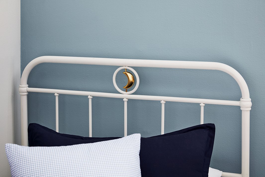 Kids will be over the moon about quirky details such as the spinning crescent on the Ellis bed.
