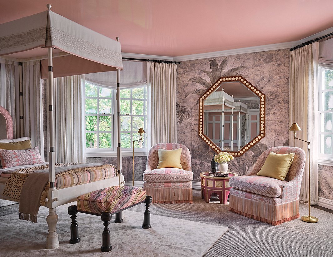 Jaipur, nicknamed the Pink City for the color commonly seen on its buildings, was one of Martyn Lawrence Bullard Design’s inspirations for this en-suite guest bedroom. The “think pink” theme extends up to the lacquered ceiling. Syrian side tables and a Moroccan rug, among other pieces, give this space globe-trotting flair. Photo by Stephen Karlisch.
