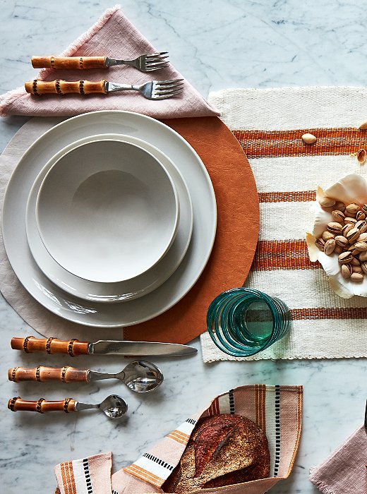 A subdued color palette adds flair to the Curator’s table. Find the dishware here and the flatware here.
