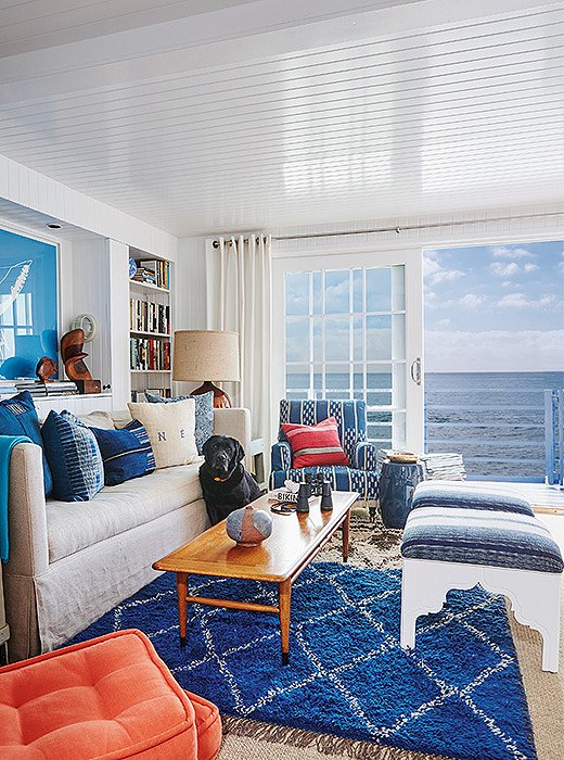 Vintage fabric was used to upholster the seating in this beach house “to create a relaxed, perfectly worn-in look,” writes Nathan.
