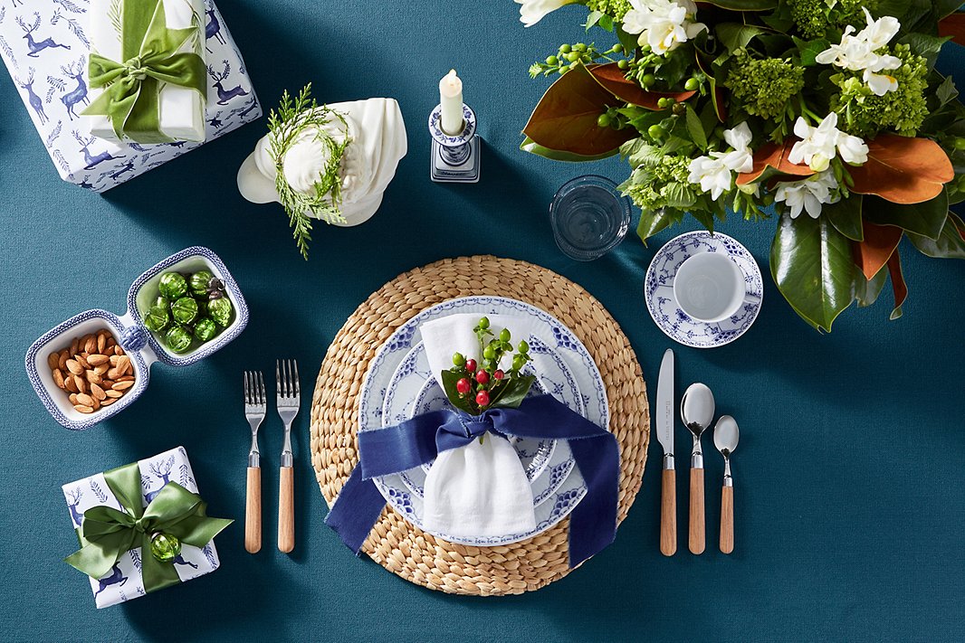 Plates, cup, and saucer: Royal Copenhagen Half Lace; flatware, Vietri Albero.
