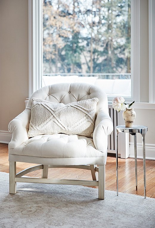 A tufted Bunny Williams chair basks in the sunshine. “If I find myself with a quiet moment, I go sit there,” Emily says. “It’s right by the window, so I’m getting the natural light. It’s a zen place for me.”
