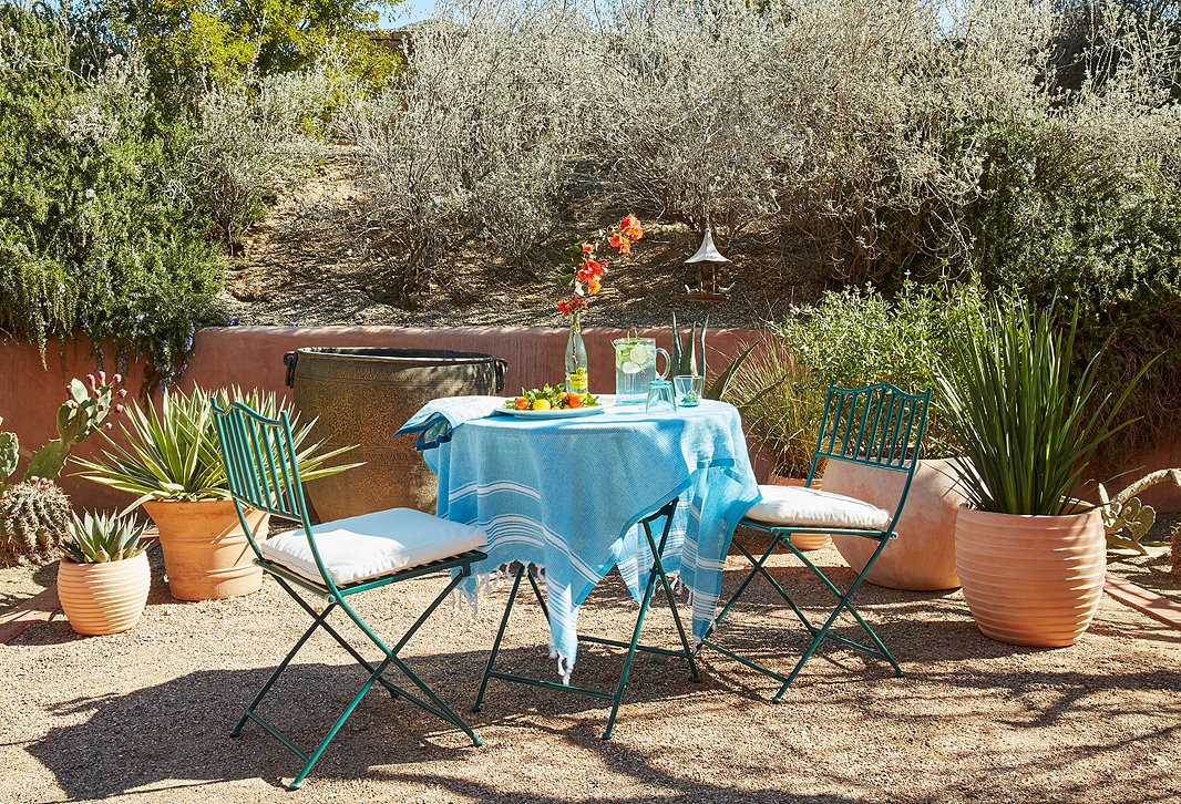 A fringed Turkish towel makes an easy tablecloth substitution (and can be thrown in the wash when the party’s over).
