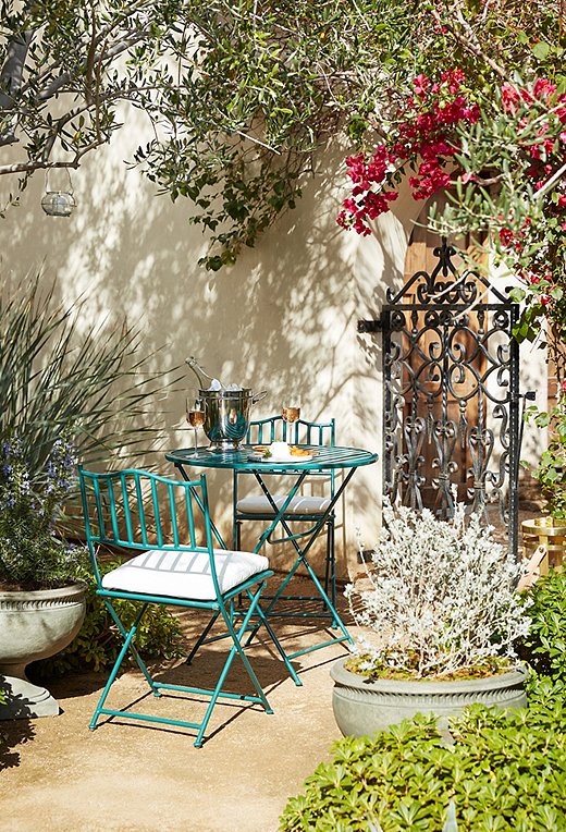 Since it easily folds up to store when not in use, a petite bistro set is a perfect entertaining solution for small outdoor spaces.

