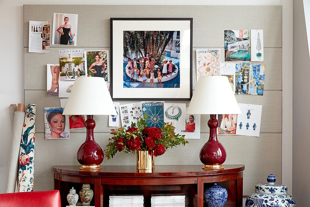 An iconic Slim Aarons photograph of Lilly Pulitzer-clad ladies in Palm Beach—another gem from the magazine’s archives—accents a conference room wall. A subtle Ralph Lauren Home ticking stripe livens up a generic office pinboard, while the mahogany Oriel Console, also by Ralph Lauren Home, provides stylish storage.

