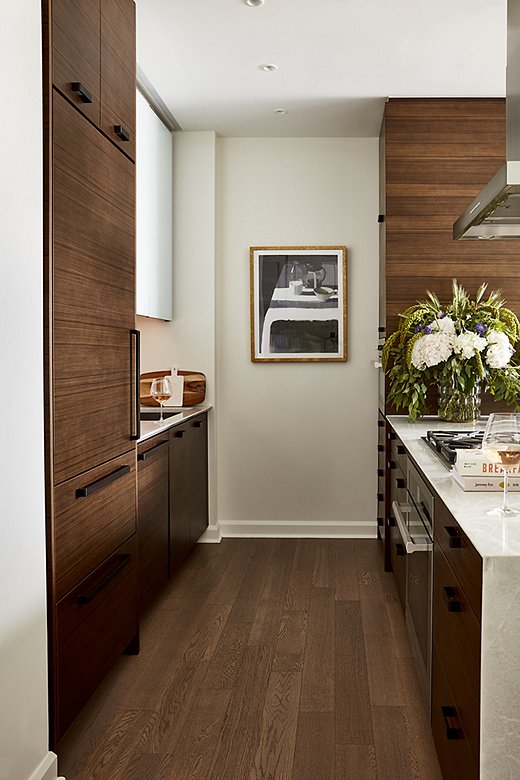 Even galley kitchens can feel spacious with the right lighting and colors. Design by One Kings Lane Interior Design; photo by Frank Tribble.
