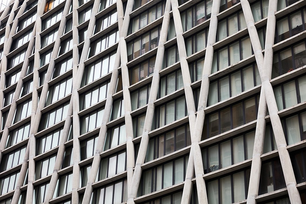 Michael and Erin’s apartment is housed in a building with a modernist exterior of criss-crossed concrete pillars.
