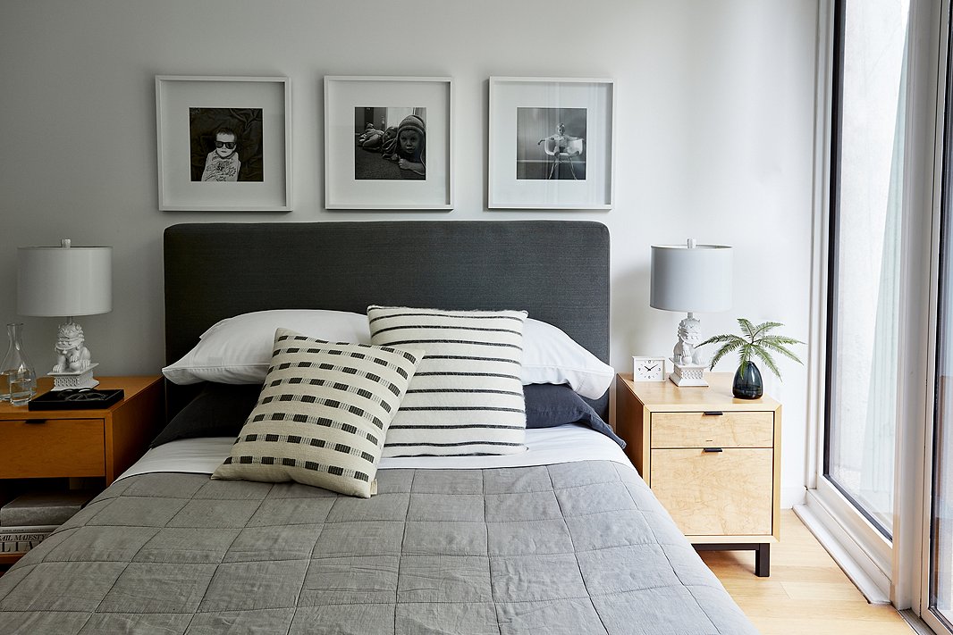 The master bedroom is all about soothing neutrals and a few personal touches. Above the bed hang three photos of the kids. “We have Nils hanging out, the two of them being goofy, and Elin doing what we call her ‘boss lady’ face. We wanted one together and then one of each that felt unique to their personality,” Michael says.
