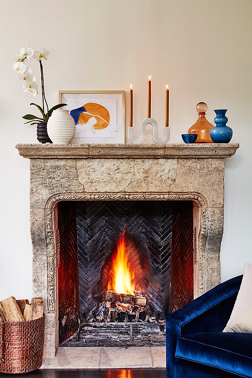 Abstract art by Rebecca Stern and the Corinth Large Marble Candleholder add a modern twist to this classic mantel.
