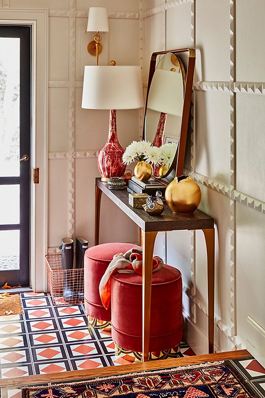 Persimmon is another color we’re loving this fall. These Piper Stools from Kim Salmela add a touch of glam to an entryway full of texture and pattern.
