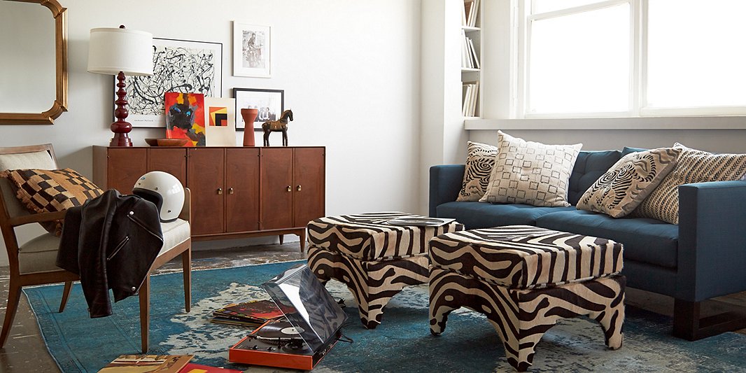 Sometimes two ottomans are better than one. They’re also a great way to introduce pattern or an accent color into a room. Find similar ottomans here.
