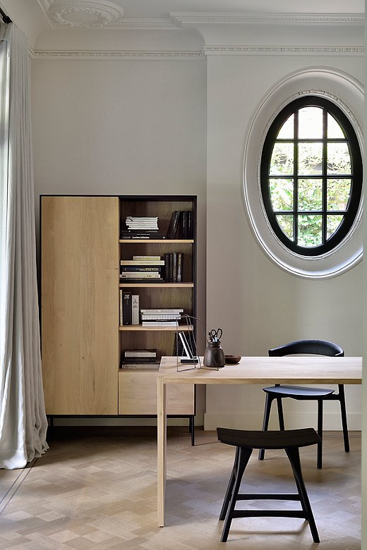 The black frame and metal legs of the Blackbird Cabinet accentuate the beauty of the oak.
