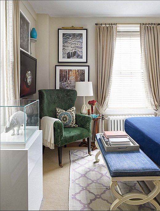 Like the rest of the apartment, the bedroom is filled with pieces from Philip and Mark’s vast art collection. The porcelain Nymphenburg rhinoceros housed in an acrylic case is a particular favorite. “It’s a traditional old thing treated like a modern sculpture,” Philip says. 
