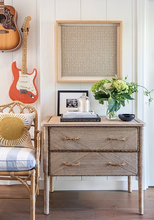 The husband, a musician, collects guitars. Marea chose to hang the guitars to free up space and add visual interest. “We picked the ones that worked best with out color palette,” she says with a laugh.
