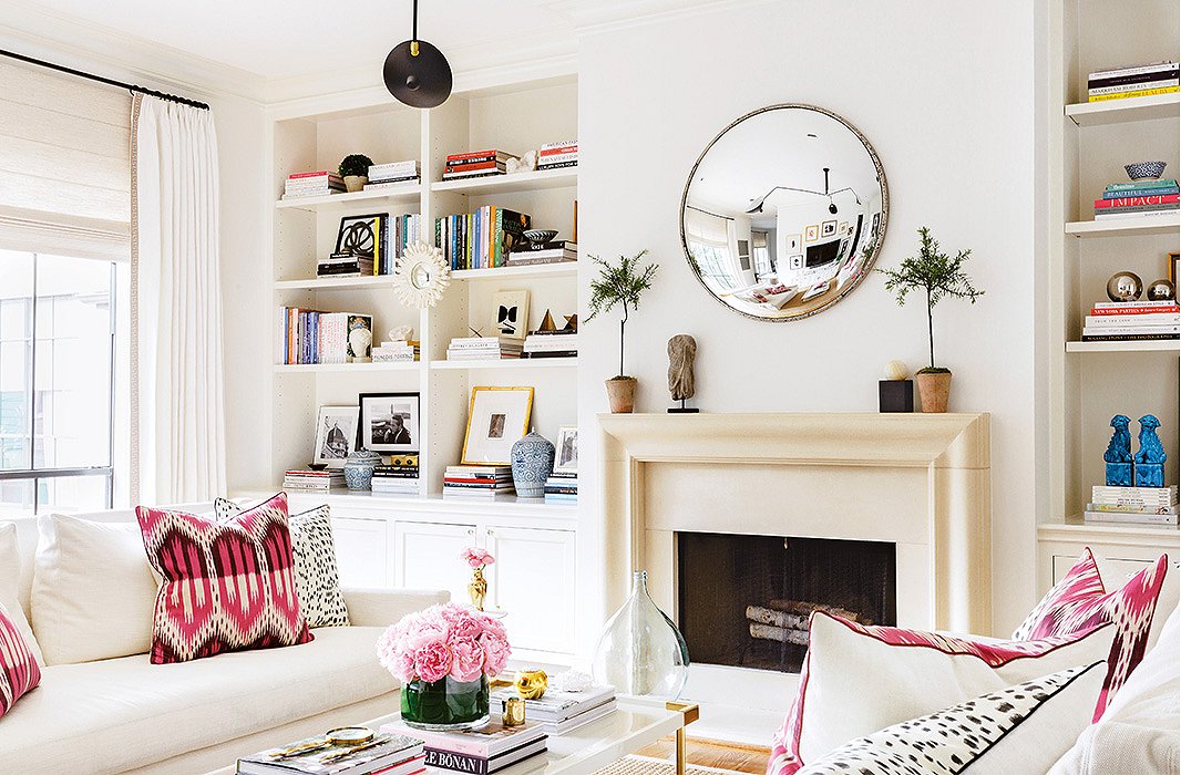 A living room with bookshelves styled to a T.
