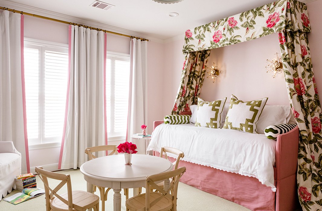 A canopy of floral fabric frames a trundle bed in a kid’s bedroom. All of the upholstery was sealed for enhanced durability.
