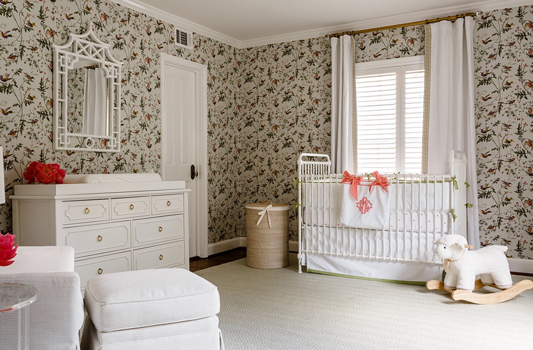 In the nursery, all-white furniture picks up on the light and airy feel found throughout the rest of the home.
