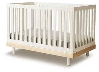 white and natural wood crib