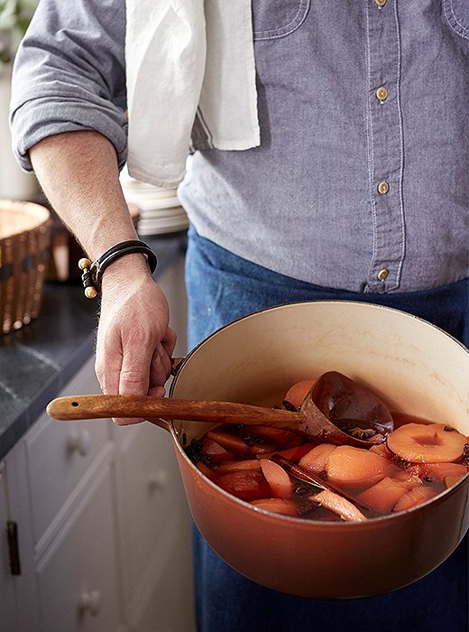 A batch of quinces in fragrant poaching liquid.
