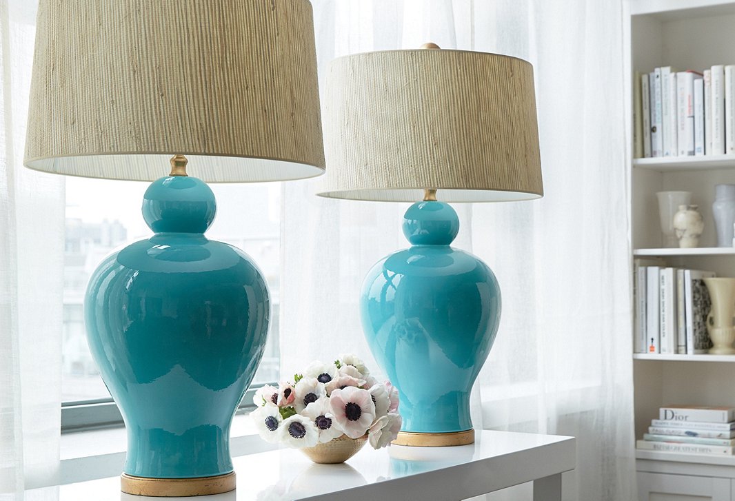 A pair of Bradburn Home table lamps beautifully anchor a console table.
