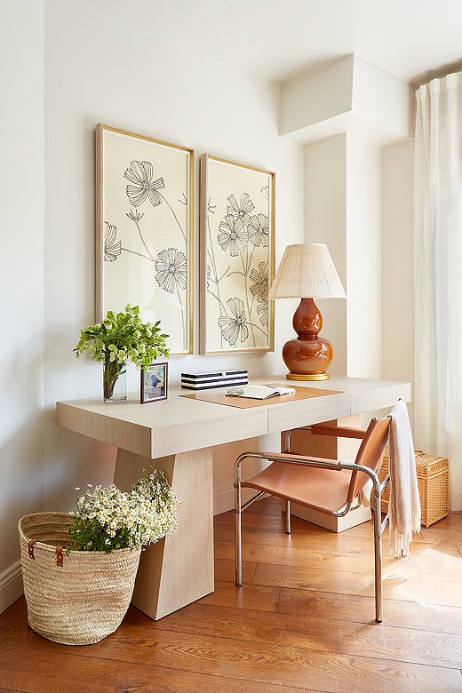 One of the first pieces Samantha and her fiancé bought was a desk, as they were both working from home. They carved out an office setup in their living room. Find the lamp here and the shade here.

