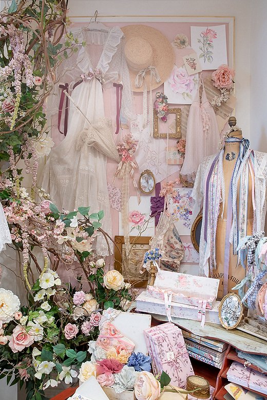 A scene from one of LoveShackFancy’s stores. Ribbon, floral accents, lace, and rococo touches are all elements of the LoveShackFancy style.
