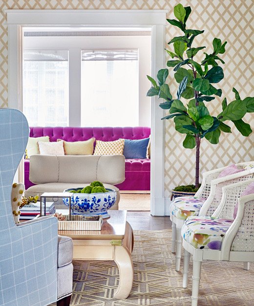 Virginia pulled the same purple from the living room chairs to a sofa in an adjacent sitting room. Continuing the color story throughout the house makes things feel cohesive.
