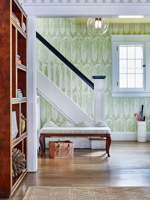 Large-scale paisley wallpaper sets the scene in the entryway. “I wanted it to feel enchanting, so I knew that we needed an oversize wallpaper in there,” says Virginia.
